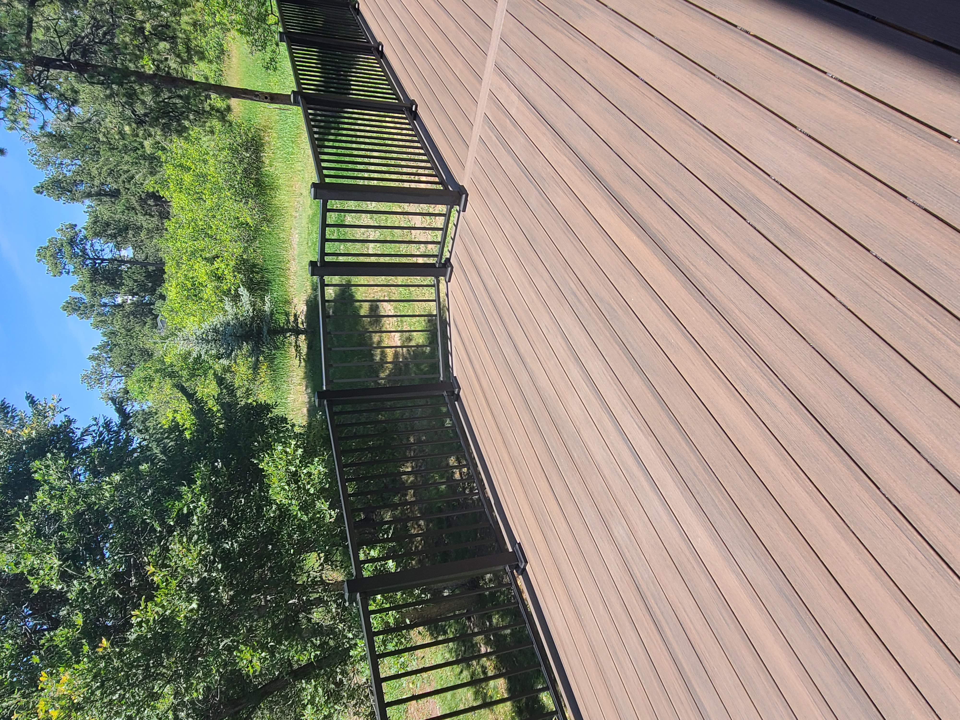 Covered patio and outdoor living space attached to a Colorado Springs home